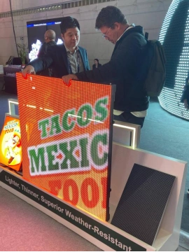 Ultra-light C-Carbon rental LED panel being lifted by one hand at ISE 2026.