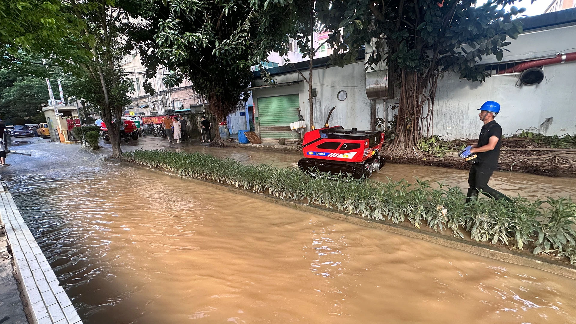 ZONDAR romote control robot walked to the disaster-stricken community at Dongguan Canton China